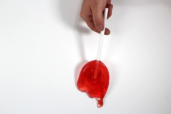Wall hanging resin candy melting sucker sculpture bright red 11 inches long find out more.