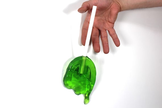 Wall hanging resin candy melting sucker sculpture lime green 11 inches long find out more.
