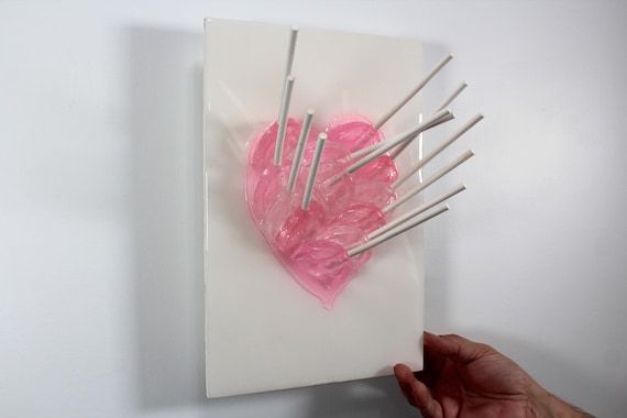 Heart fractal resin pink suckers melting down the wall 3D art.  Colorful fun wall art.