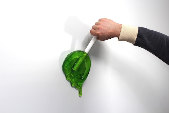 Giant oversized resin sucker melting wall art sculpture bright lime green find out more.