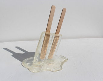 Resin twin popsicle double stick melting sucker sculptures, clear, find out more.