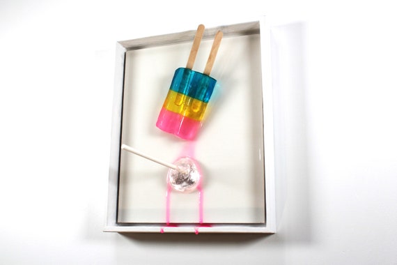 Popsicle blow pop melting down the wall 3D art.  Colorful fun resin wall art.