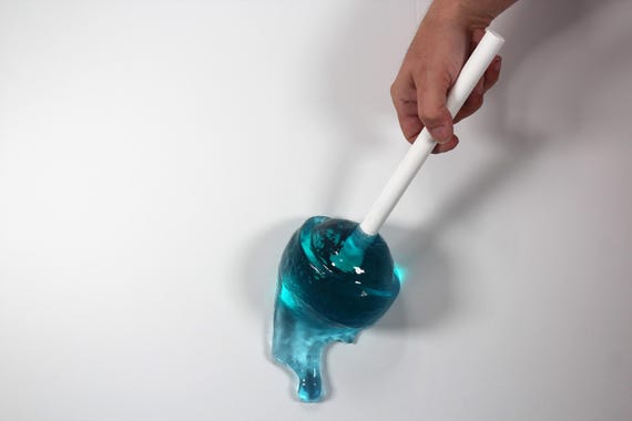 Giant wall blow pop lollypop tootsie pop melting down the wall bight blue resin sculpture find out more.