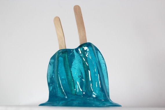 Resin twin popsicle double stick melting sucker sculpture bright blue find out more.