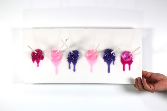 Blow pops melting down the wall 3D art.  Colorful fun resin wall art find out more.