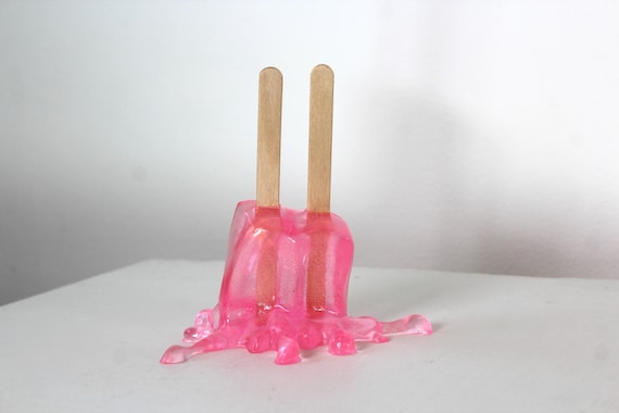 Resin twin popsicle double stick melting sucker sculpture splat on the table Hot pink find out more.