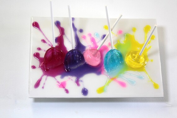 Blow pops suckers melting down the wall 3D art.  Colorful fun resin wall art.