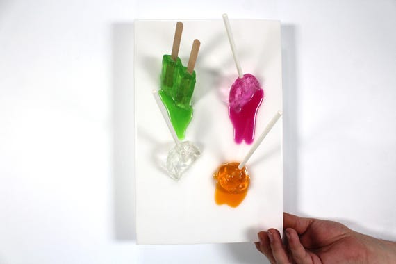 Popsicles blow pops melting down the wall 3D art.  Colorful fun resin wall art.