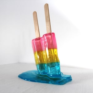 Resin twin popsicle double stick melting colorful sucker sculptures, find out more.