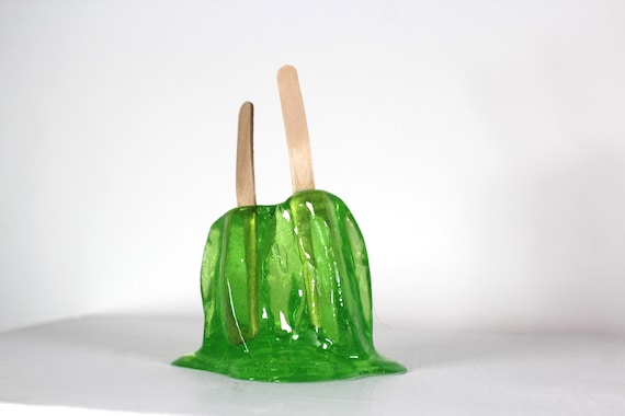 Resin twin popsicle double stick melting sucker sculpture lime green find out more.