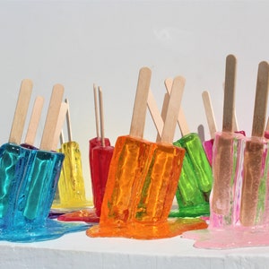 Resin twin popsicle double stick melting sucker sculptures, pick your color, find out more.