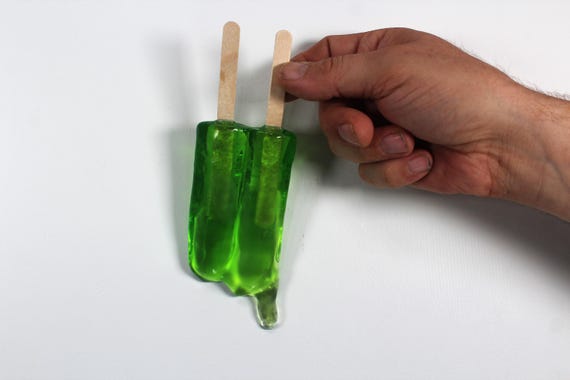 Wall hanging resin twin popsicle double stick melting sucker sculptures lime green find out more.