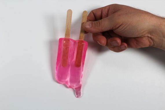 Wall hanging resin twin popsicle double stick melting sucker sculptures hot pink find out more.
