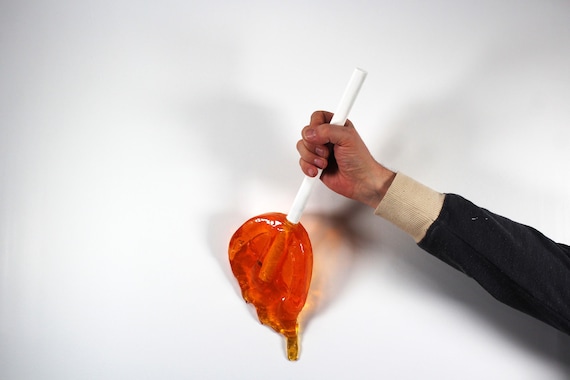 Giant oversized resin sucker melting wall art sculpture citric orange find out more.