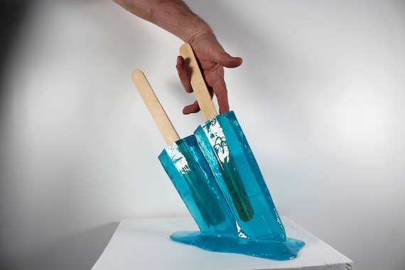 Giant oversized 12" tall bright blue resin twin popsicle double stick melting sucker sculpture, find out more.