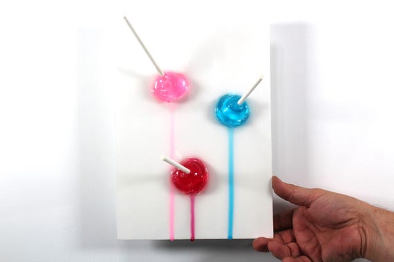 Blow pops melting down the wall 3D art.  Colorful fun resin wall art.
