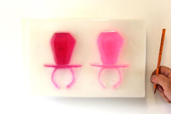 Giant oversized ring pop resin sculpture hot pink 3D wall art find out more.