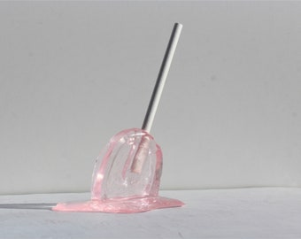 Sucker pink resin melting candy sculpture find out more.