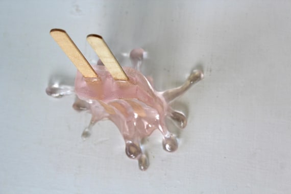 Resin twin popsicle double stick melting sucker sculpture splat on the table light pink find out more.