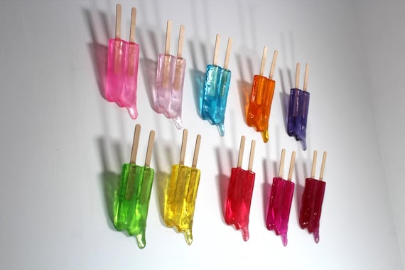 Wall hanging resin twin popsicle double stick melting sucker sculptures pick your color find out more.