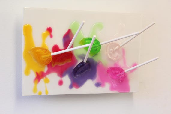 Blow pops suckers melting down the wall 3D art.  Colorful fun resin wall art.
