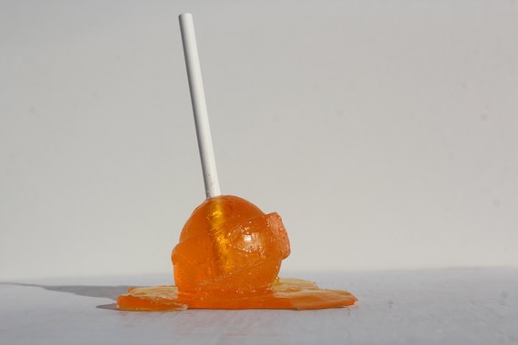 Blow pop resin sucker bright orange sculpture, find out more.