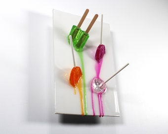 Popsicles blow pops melting down the wall 3D art.  Colorful fun resin wall art.