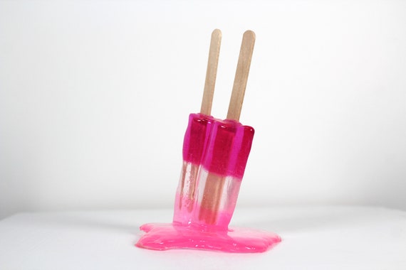 Resin twin popsicle double stick melting colorful pinks sucker sculptures, find out more.