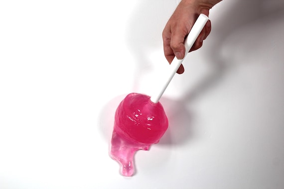 Giant wall blow pop lollypop tootsie pop melting down the wall hot pink resin sculpture find out more.