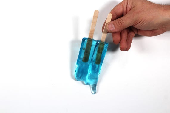 Wall hanging resin twin popsicle double stick melting sucker sculptures bright blue find out more.