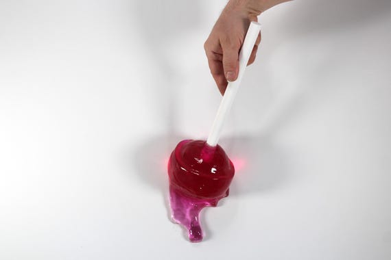 Giant wall blow pop lollypop tootsie pop melting down the wall Magenta resin sculpture find out more.