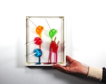 Popsicles blow pops melting down the wall 3D art.  Colorful fun resin wall art.