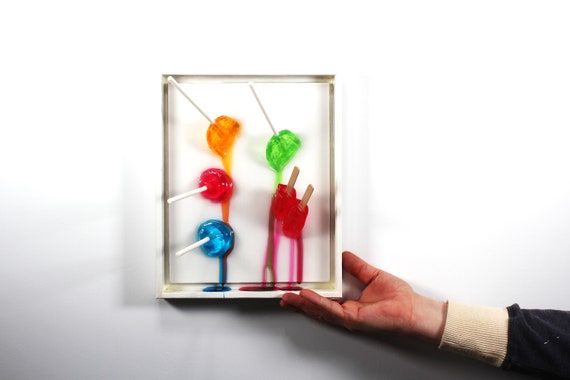 Popsicles blow pops melting down the wall 3D art.  Colorful fun resin wall art.