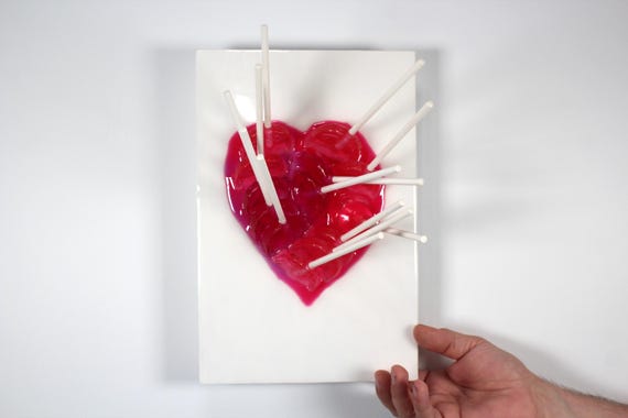 Heart fractal resin red suckers melting down the wall 3D art.  Colorful fun wall art.