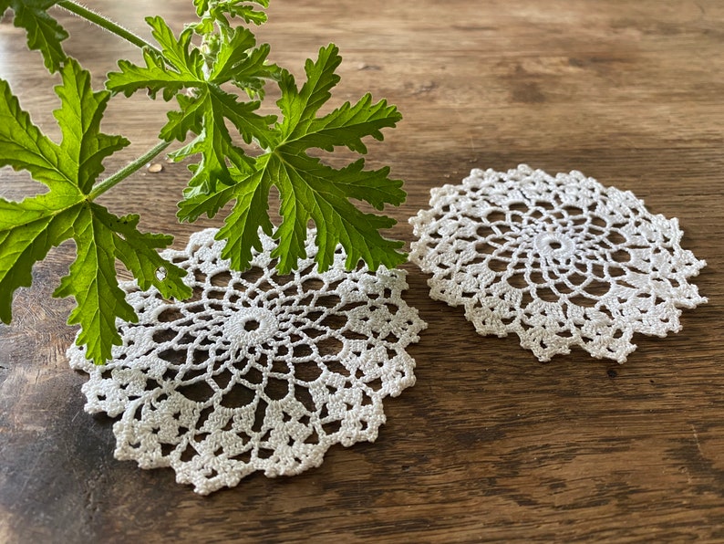 Two lovely hand crocheted doilies 8 cm