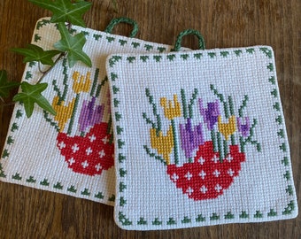 A pair of hand cross stitched vintage pot holders / Scandinavian