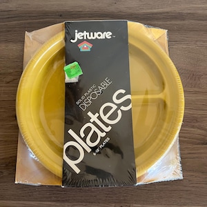 May include: A pack of 6-10 inch yellow disposable plates from Jetware. The packaging reads "Solid Plastic Disposable Plates".