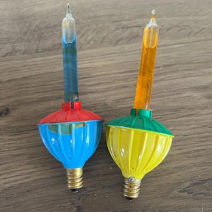 2 vintage bubble light bulbs 1 works 1 not working 60s christmas lights blue red orange green yellow kitschy christmas mid century xmas deco