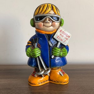 Vintage skiing piggy bank, dough for the tow coin bank boy skier 70s likely chalkware