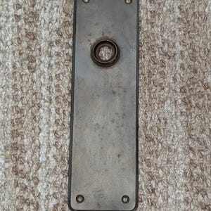 2 3/8" x 7 15/16" Antique Stamped Steel Door Knob Plate
