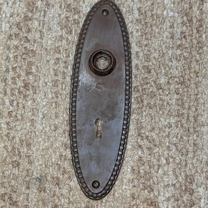 Plaque de bouton de porte en acier perlé ovale antique 2 1/4 po. x 7 3/8 po.