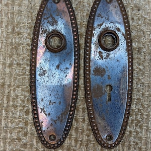 2 1/4&quot; x 7 3/8&quot; Pair Of Antique Stamped Steel Door Knob Plates