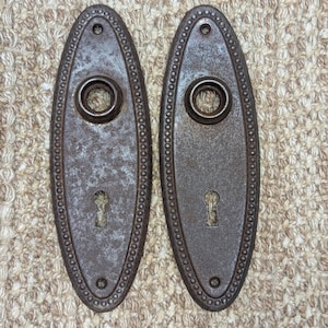 Pair Of 2 1/4&quot; x 6 3/4&quot; Antique Stamped Steel Door Knob Plates