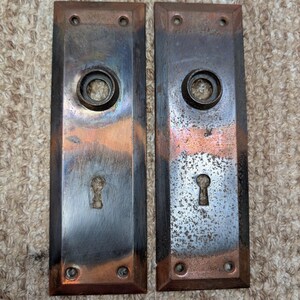Pair 2 1/4" x 7" Antique Japanned Stamped Steel Door Knob Plates