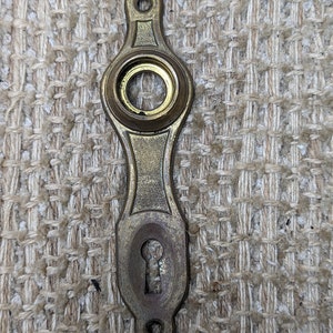 1  1/4&quot; x 4 15/16&quot; Antique Stamped Brass Door Knob Plate