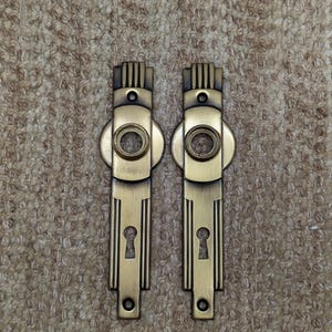 1 5/8&quot; x 6 1/4&quot; Pair Of Antique Stamped Steel Door Knob Plates