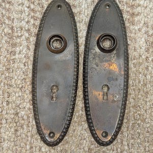2 1/4&quot; x 7 3/8&quot; Pair Of Antique Stamped Steel Door Knob Plates