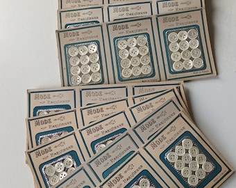 36 Small mother-of-pearl buttons, 9mm, 10mm and 11mm distributed on a large card, 1940's. 36 vintage small mother of pearl buttons,