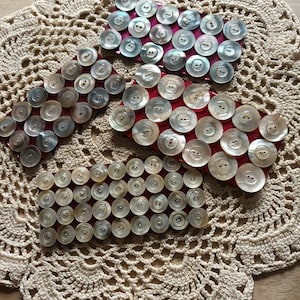 Cates of buttons in real blue mother-of-pearl, mm, on card, 1940's.mother of pearl buttons, image 1