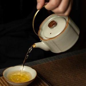 Tetera con mango de elevación pequeña, tetera de Kungfu con esmalte agrietado Ruyao de cerámica encantadora